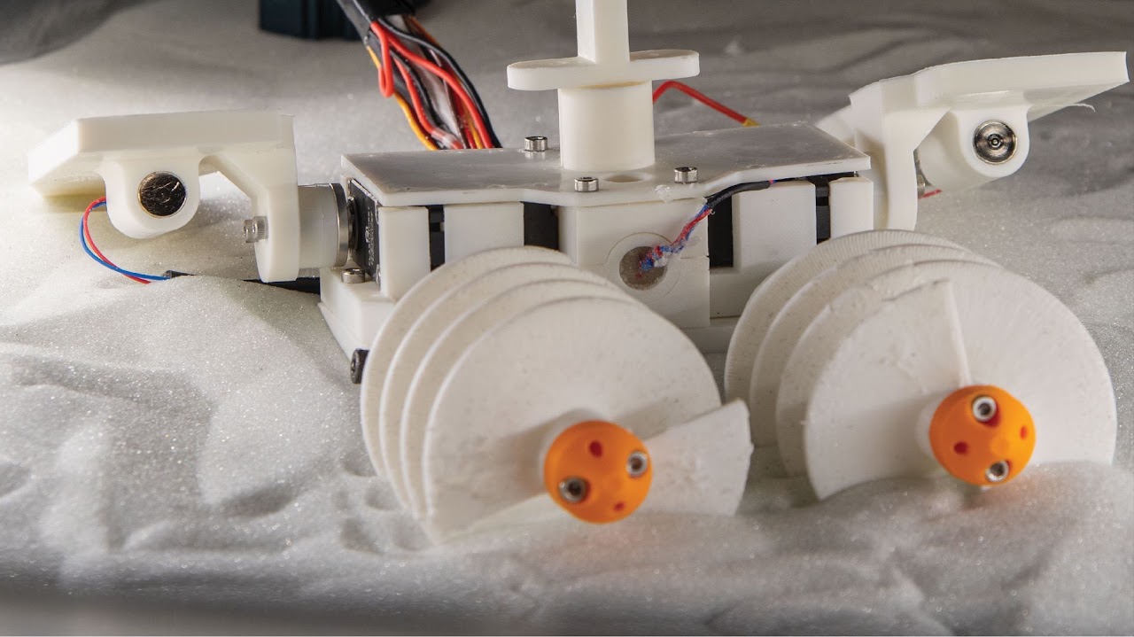 Multi-functional crawling and digging robot in granular media